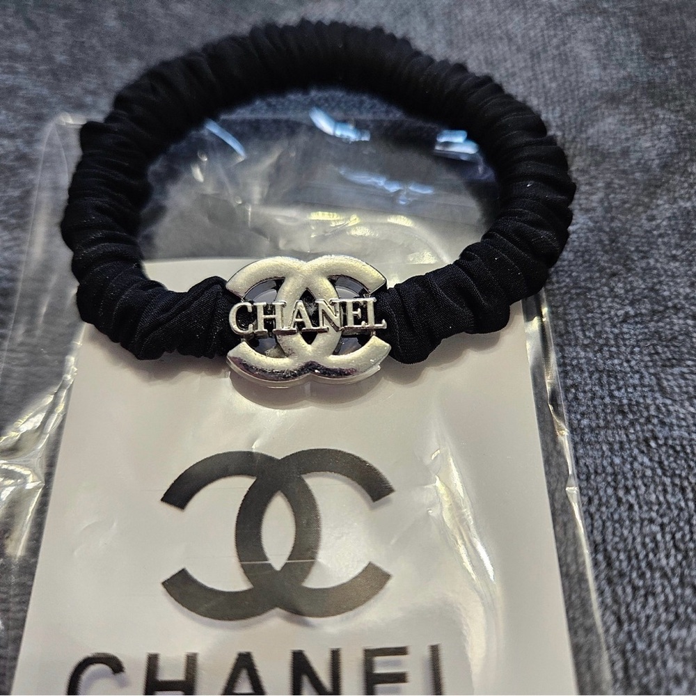 CHANEL Black Hair Accessory with Silver Emblem